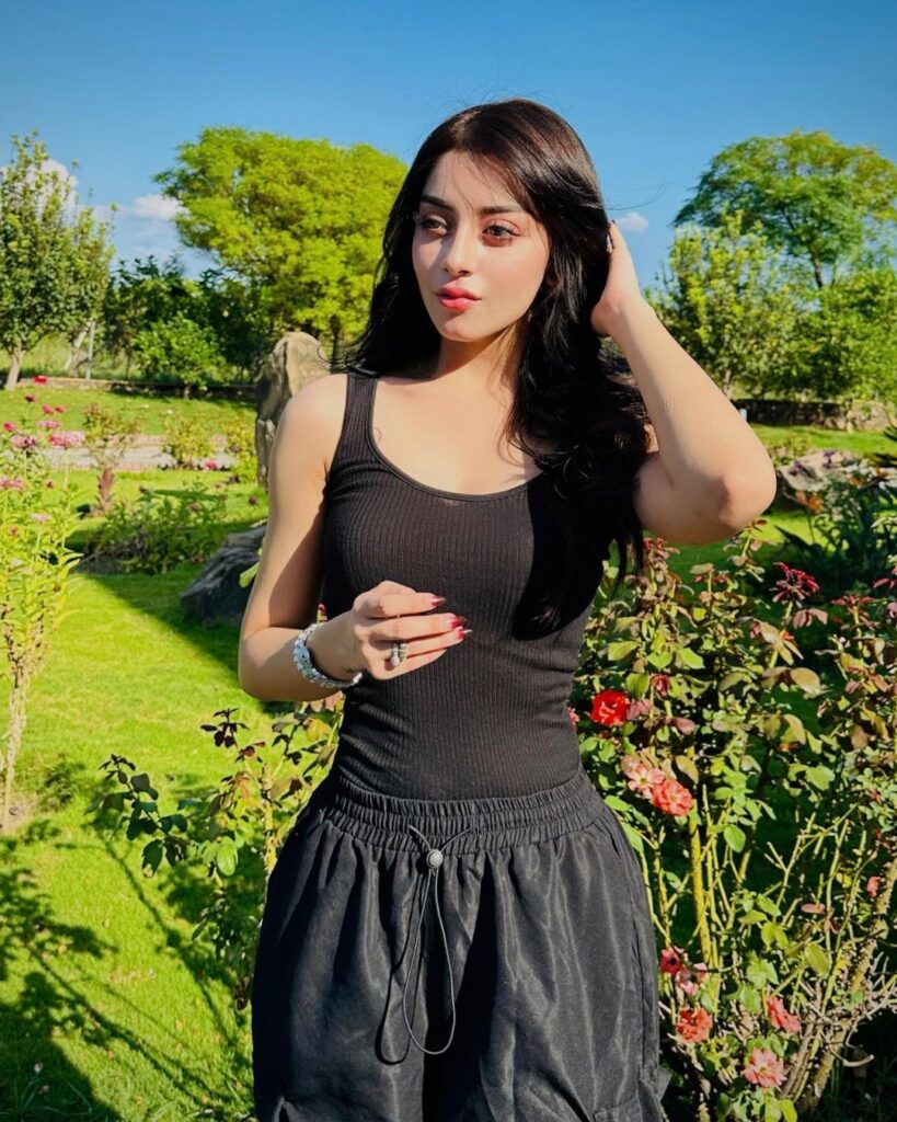 Alizah Shah in a black tank top